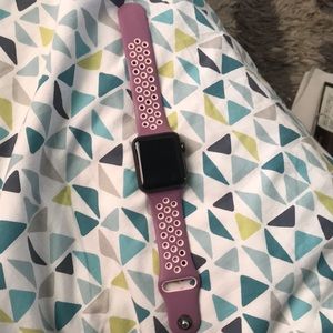 Apple Watch Series 1 with purple/pink band